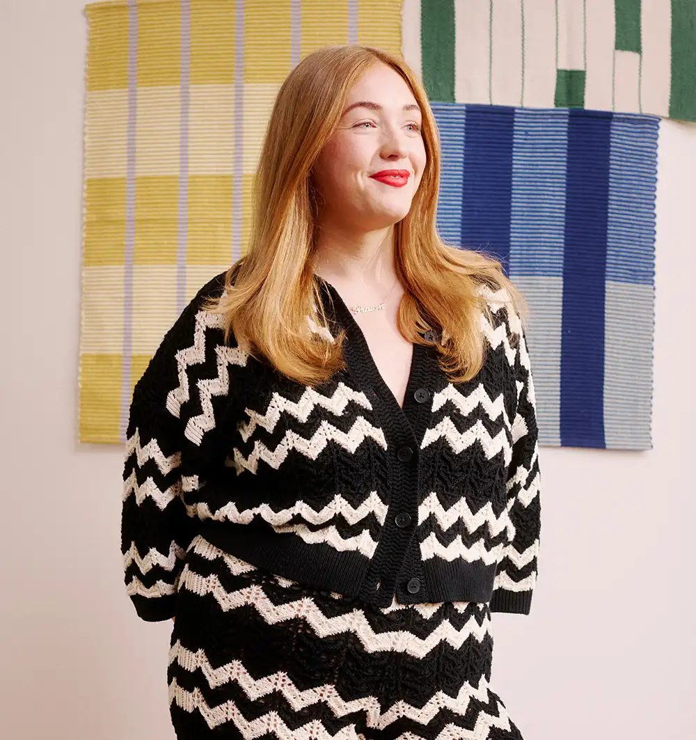 Female John Lewis partner in professional photo smiling away from camera