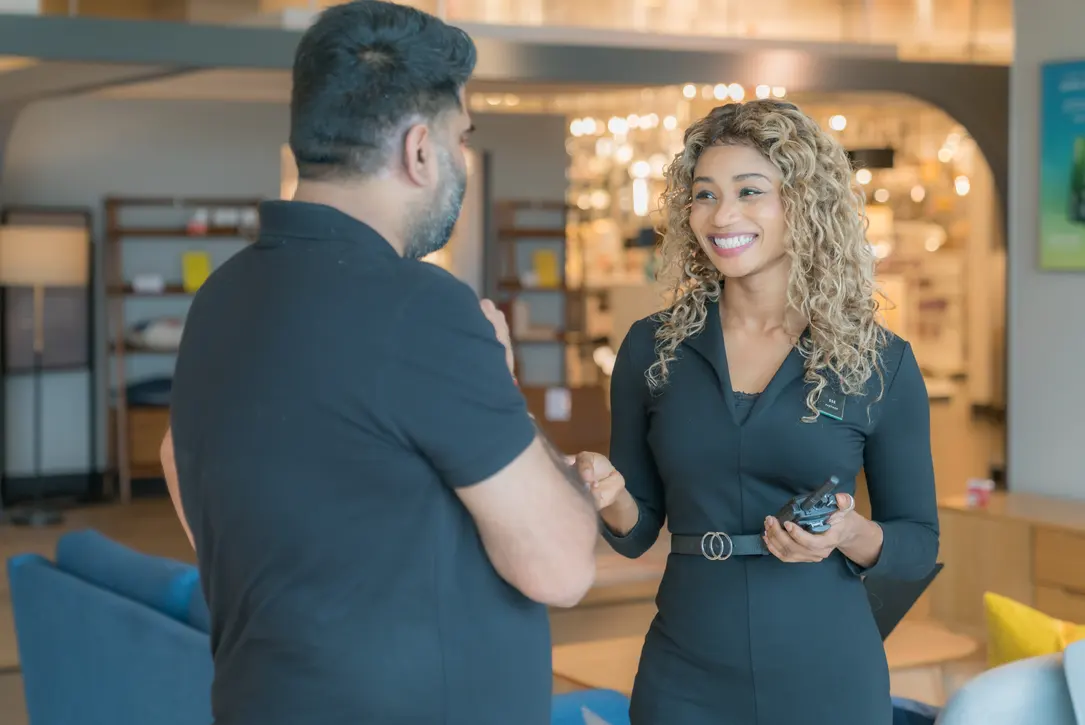 Retail assistants chatting on shop floor