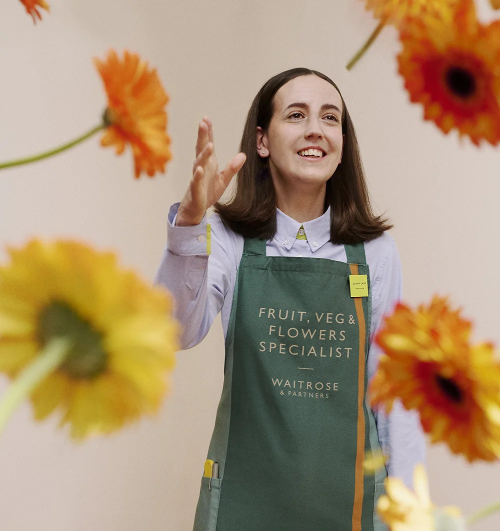 Shop Assistant throwing flowers in the air