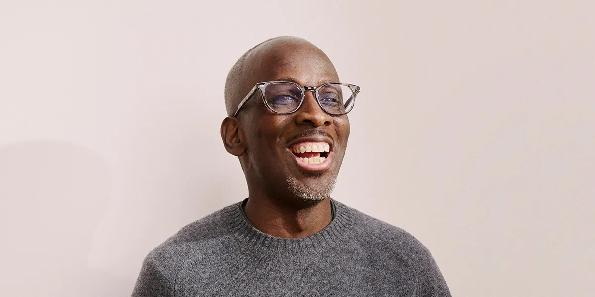 John Lewis partner in professional photo laughing