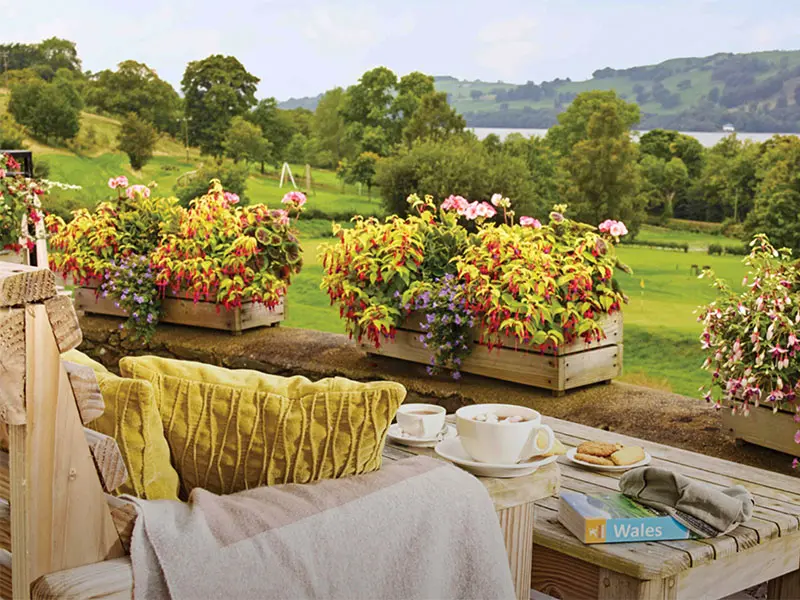 Chair with blanket and refreshments looking out over rolling hills