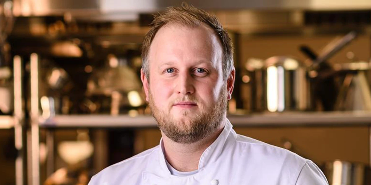 Chef staring confidently into the camera