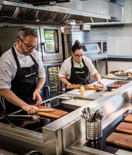 Chefs prepping in a kitchen