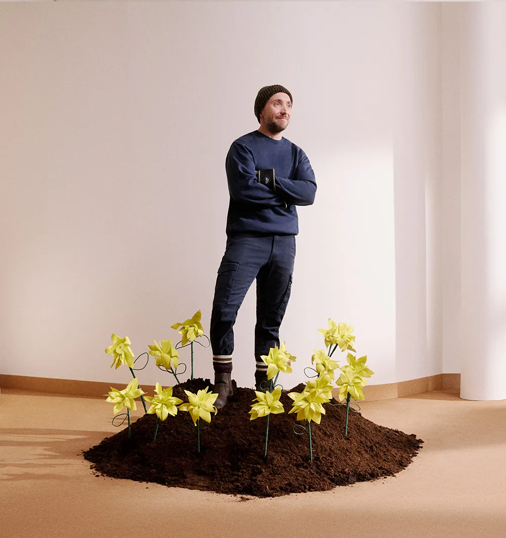 Conceptual image of man standing in daffodil patch
